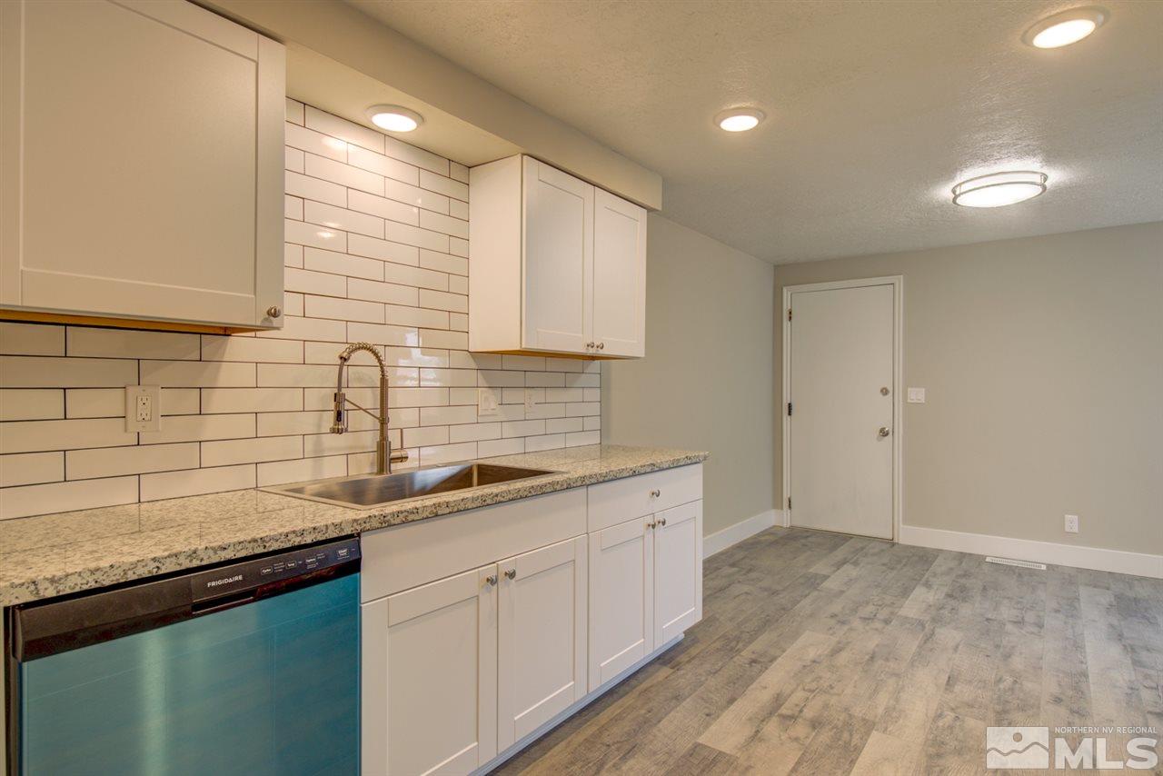 6755 Lotus Street Reno, NV 89506 - Photo 8 of 27 a kitchen with a sink and cabinets