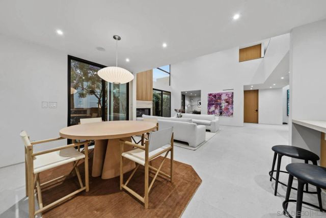 a bathroom with a tub shower vanity and toilet
