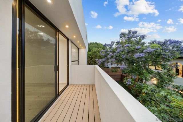 a bedroom with a bed and a flat tv screen