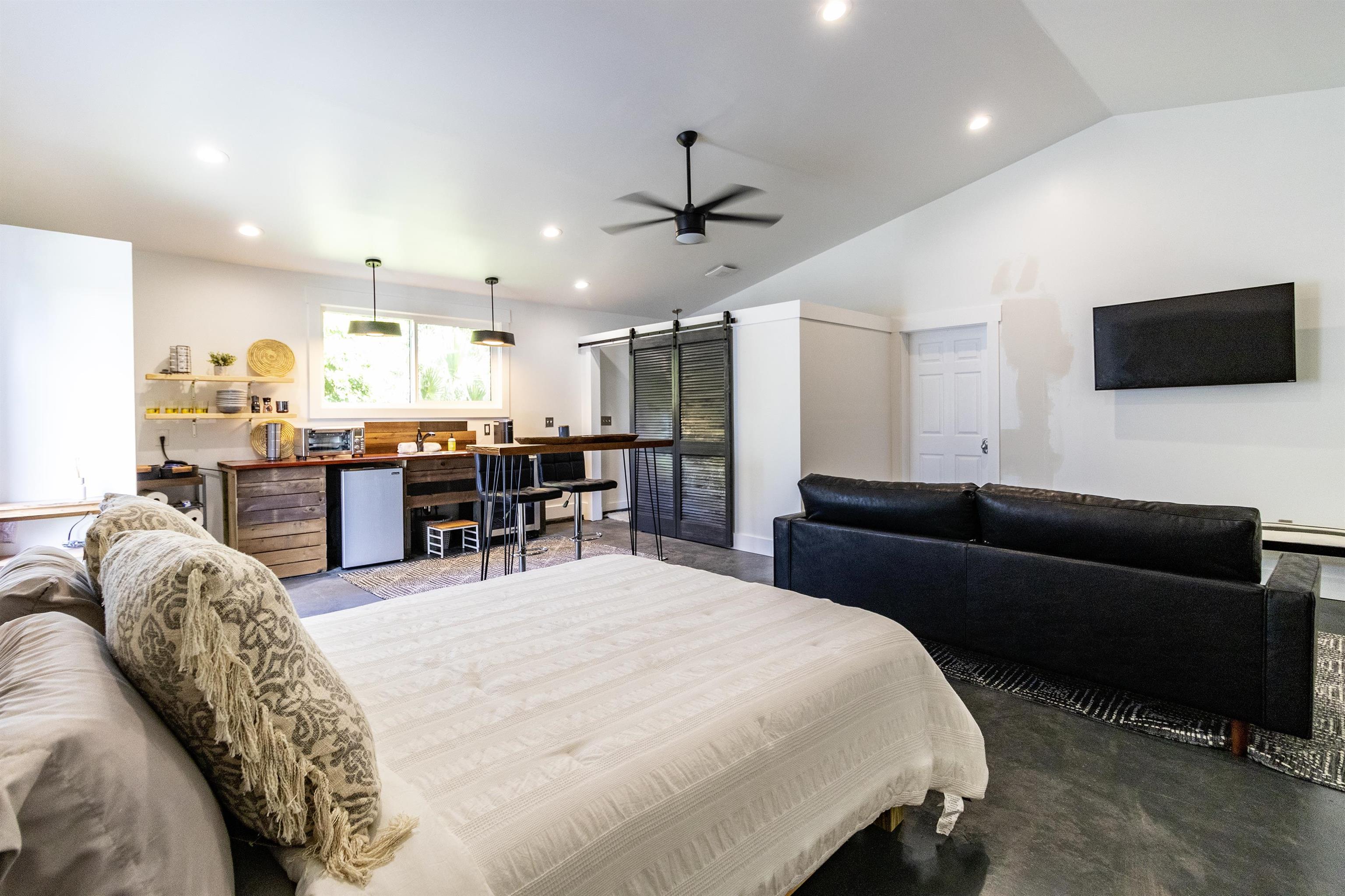 103 B Evergreen Avenue, Unit B St. Augustine, FL 32084 - Photo 11 of 19 a living room with furniture and a flat screen tv
