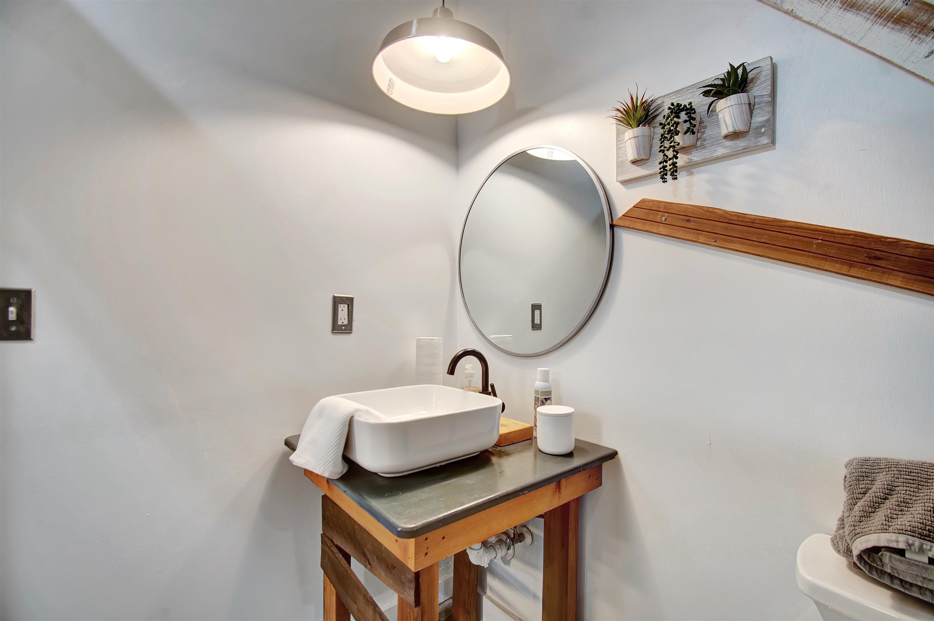 103 B Evergreen Avenue, Unit B St. Augustine, FL 32084 - Photo 15 of 19 a bathroom with a sink and a mirror