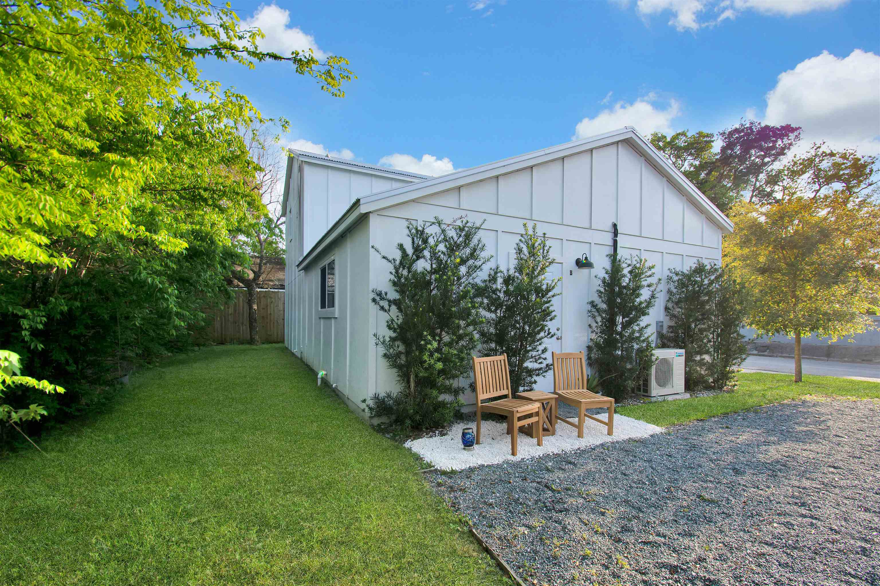 103 B Evergreen Avenue, Unit B St. Augustine, FL 32084 - Photo 18 of 19 a backyard of a house with table and chairs