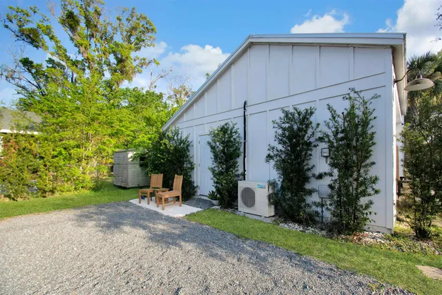 a view of a back yard with flower plants