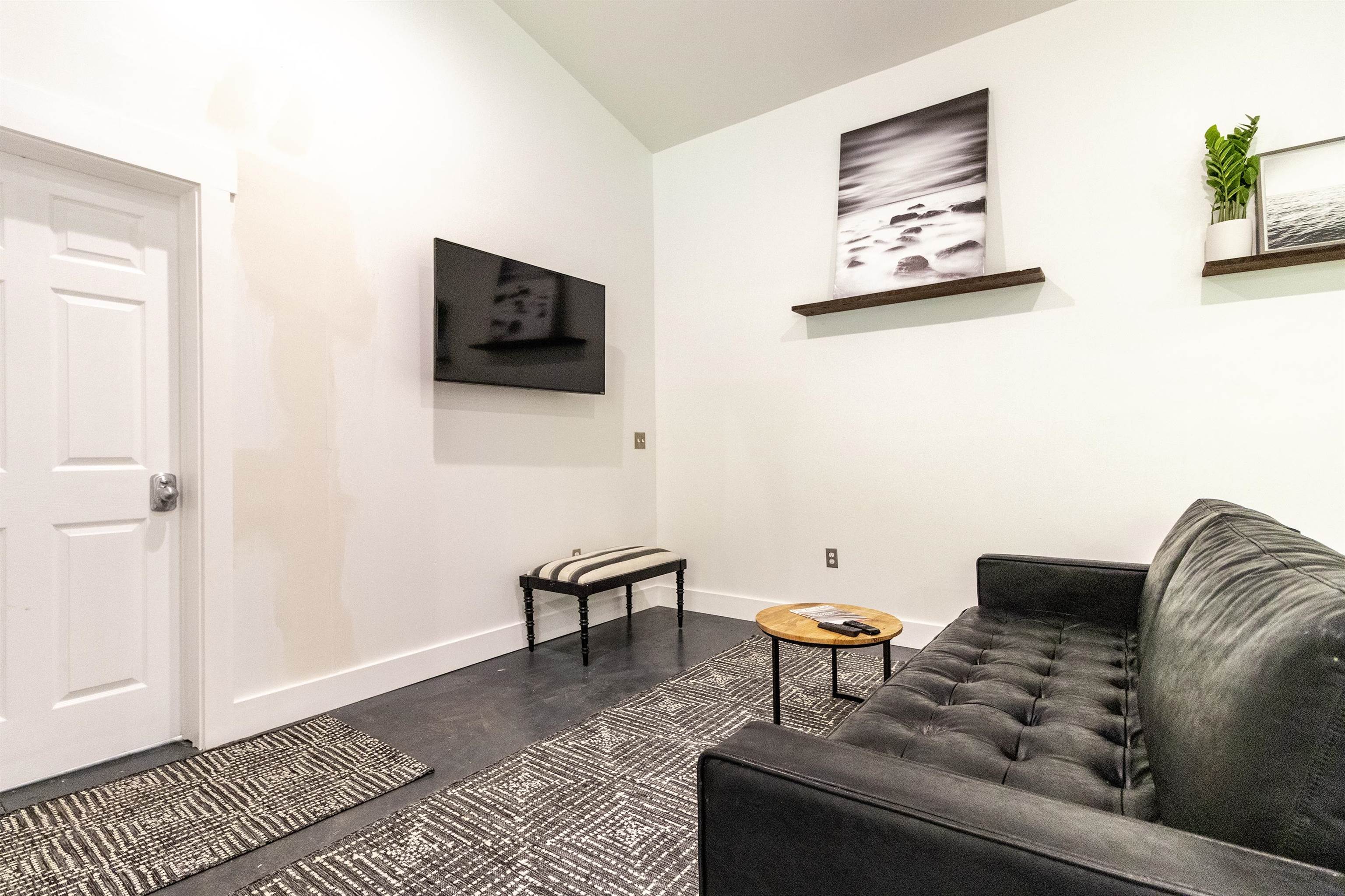 103 B Evergreen Avenue, Unit B St. Augustine, FL 32084 - Photo 7 of 19 a living room with furniture and a flat screen tv