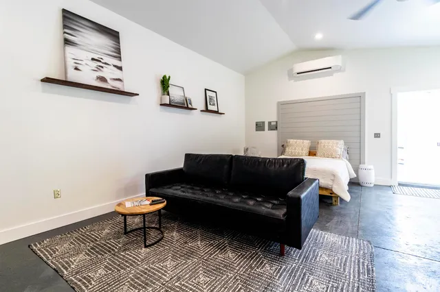 a living room with furniture and a rug