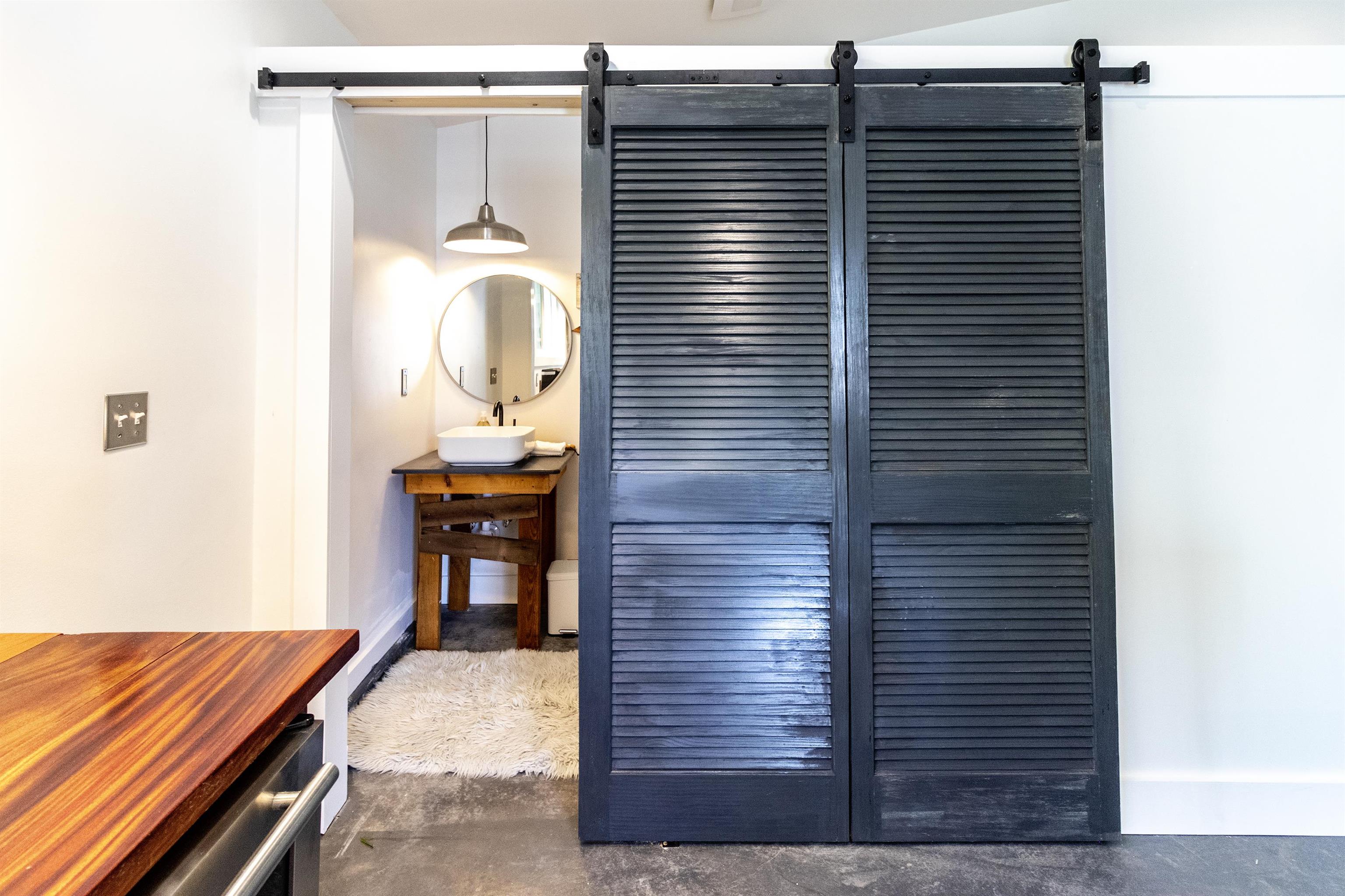 103 B Evergreen Avenue, Unit B St. Augustine, FL 32084 - Photo 10 of 19 a bathroom with a sink and a mirror