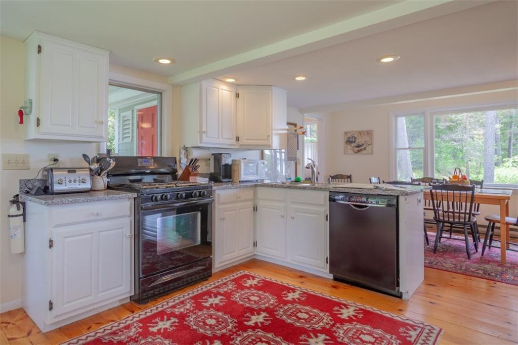 24 Chandler Road Boothbay, ME 04537 - Photo 5 of 24 The kitchen open to dining room with...
