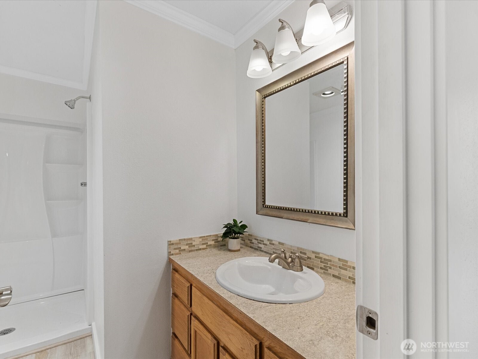 7822 Songbird Way Clinton, WA 98236 - Photo 17 of 38 a bathroom with a sink vanity and a mirror