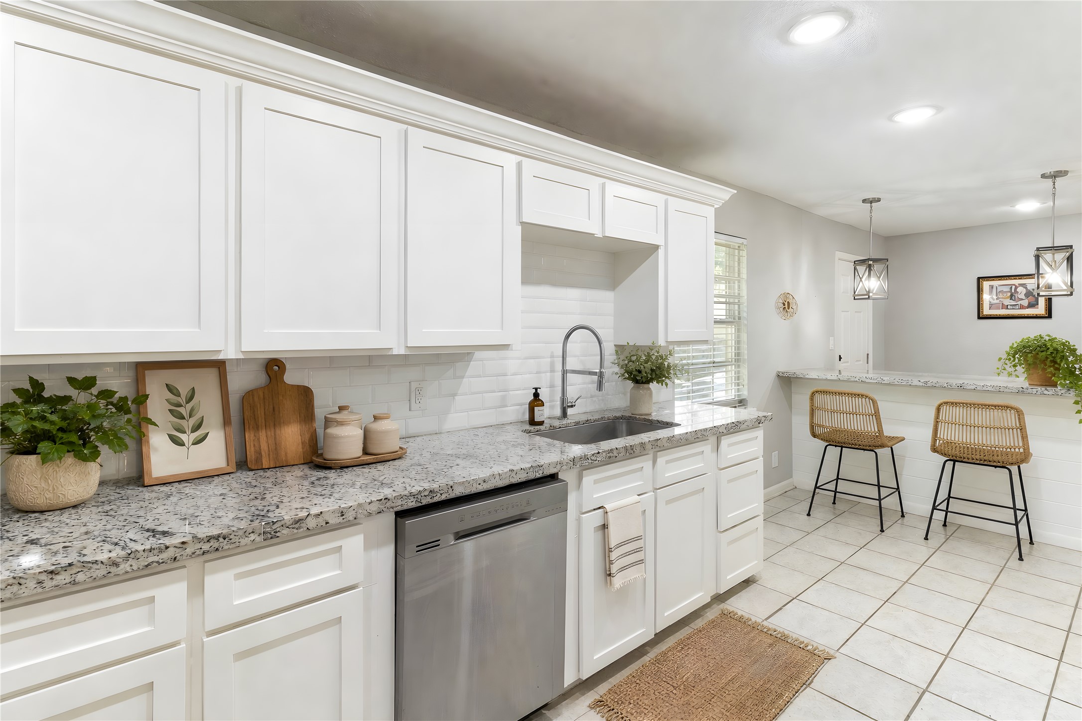117 Cannon Street Clute, TX 77531 - Photo 10 of 24 6-person island seating, stainless appliances and a large window help the kitchen feel open and bright.