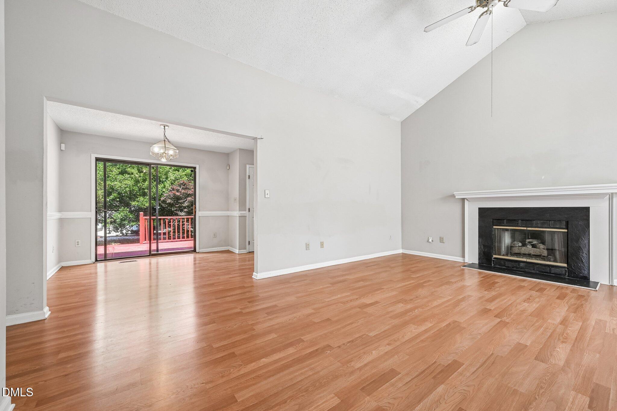 2800 West Jameson Road Raleigh, NC 27604 - Photo 3 of 24 a view of an empty room with a window and fireplace