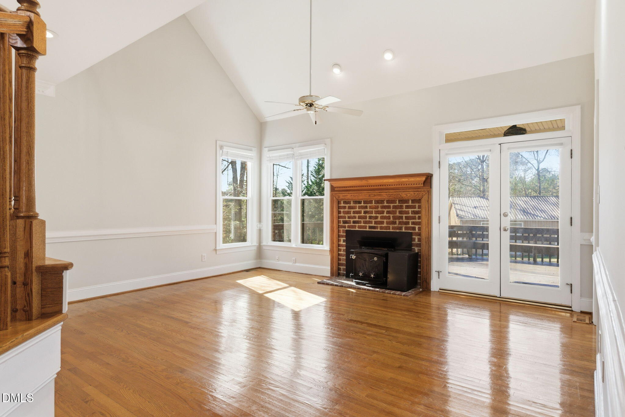 7400 Green Hope School Road Cary, NC 27519 - Photo 8 of 48 an empty room with fireplace wooden floor and windows