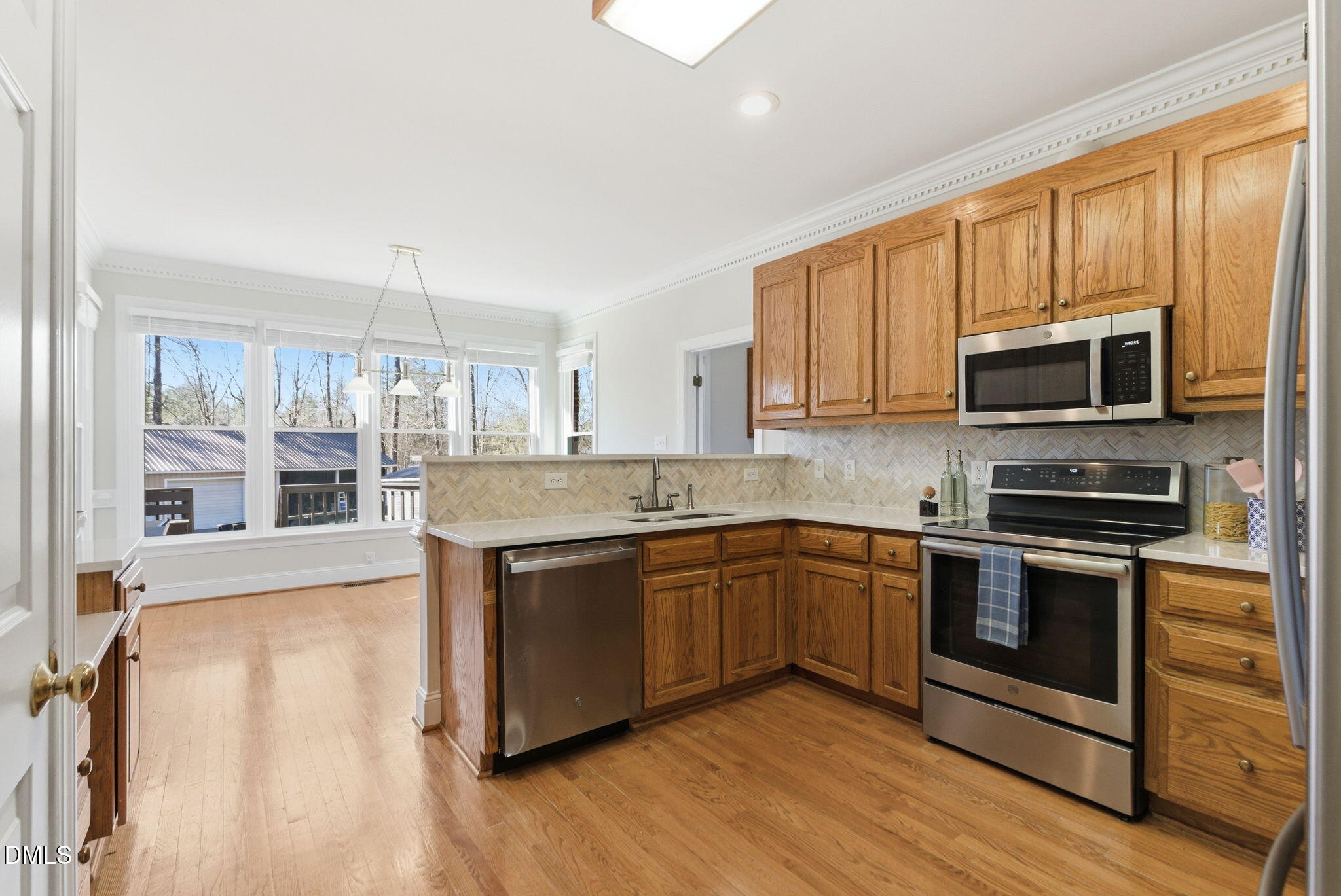 7400 Green Hope School Road Cary, NC 27519 - Photo 12 of 48 a kitchen with stainless steel appliances granite countertop a stove a sink and a microwave