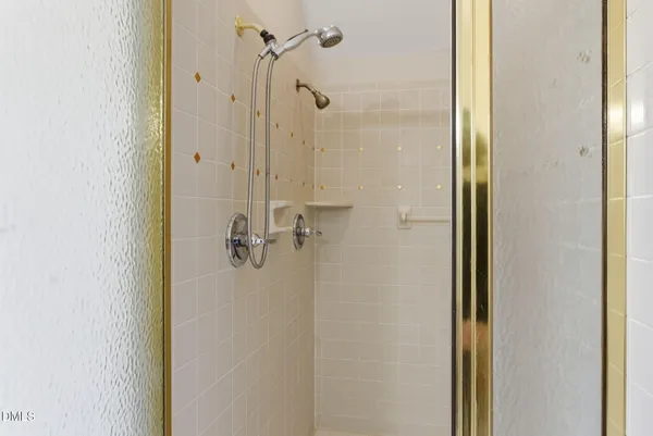 a bathroom with a bathtub sink mirror and toilet