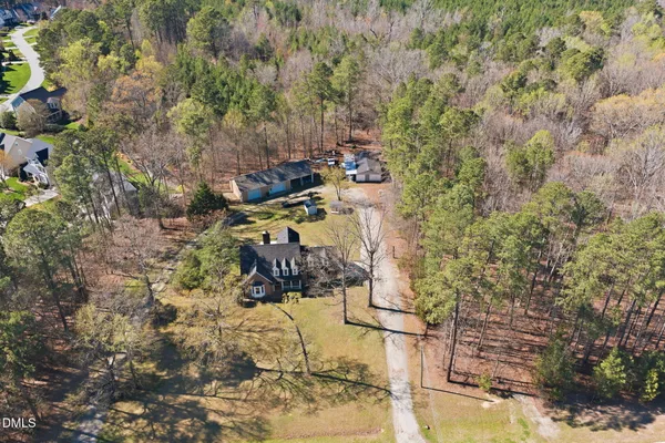 a view of a backyard with chairs