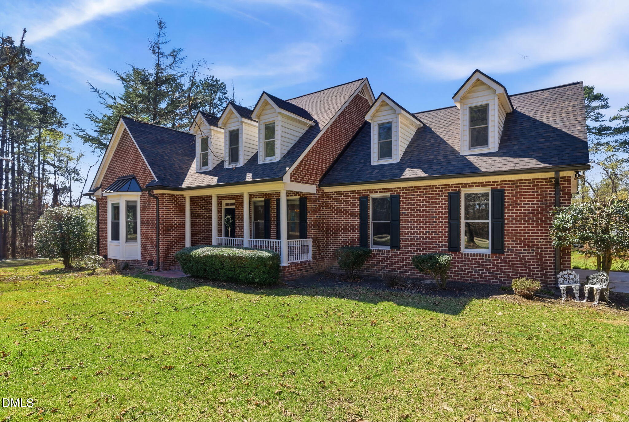 7400 Green Hope School Road Cary, NC 27519 - Photo 3 of 48 a front view of a house with garden