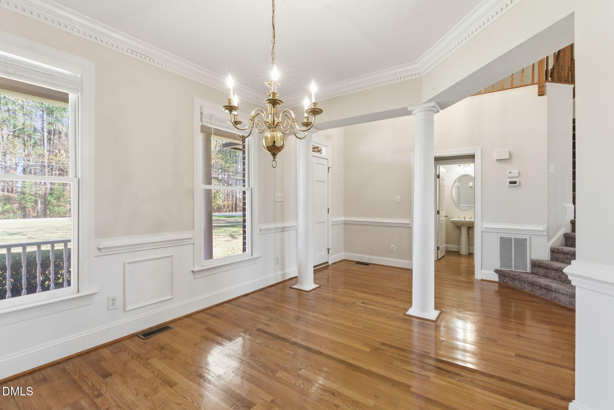 7400 Green Hope School Road Cary, NC 27519 - Photo 7 of 48 a view of an empty room with wooden floor and a window