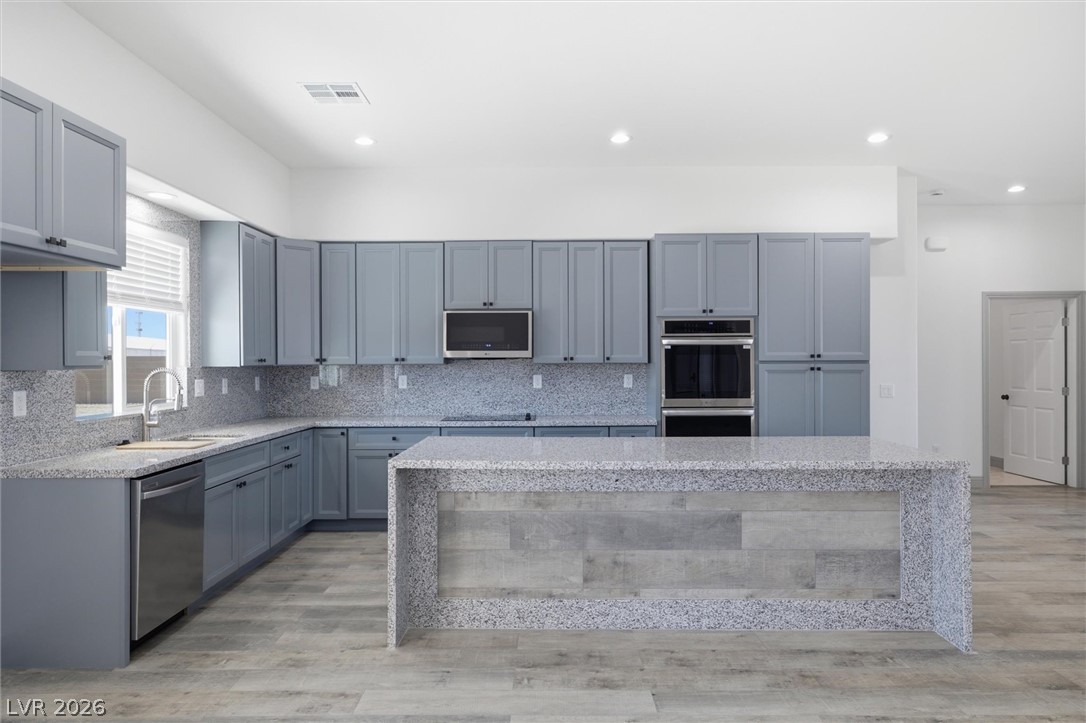 1061 Factory Road Pahrump, NV 89048 - Photo 11 of 41 Culinary creations come to life in this kitchen, featuring ample counter space and modern appliances.