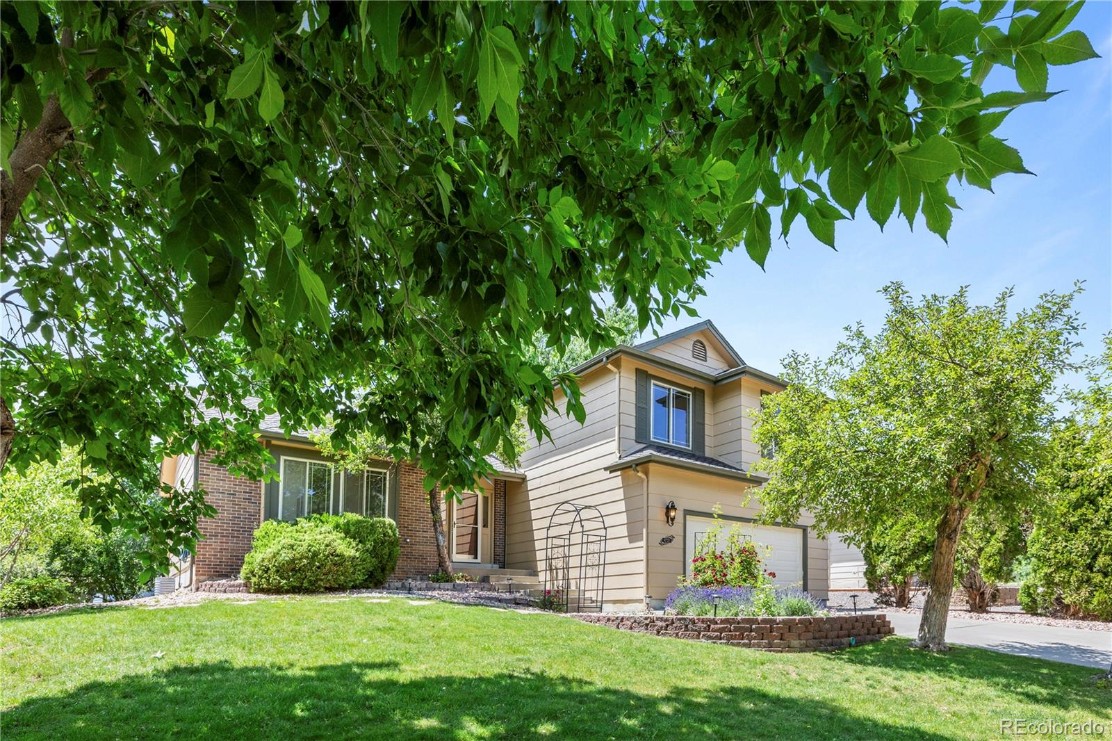 front view of a house with a yard