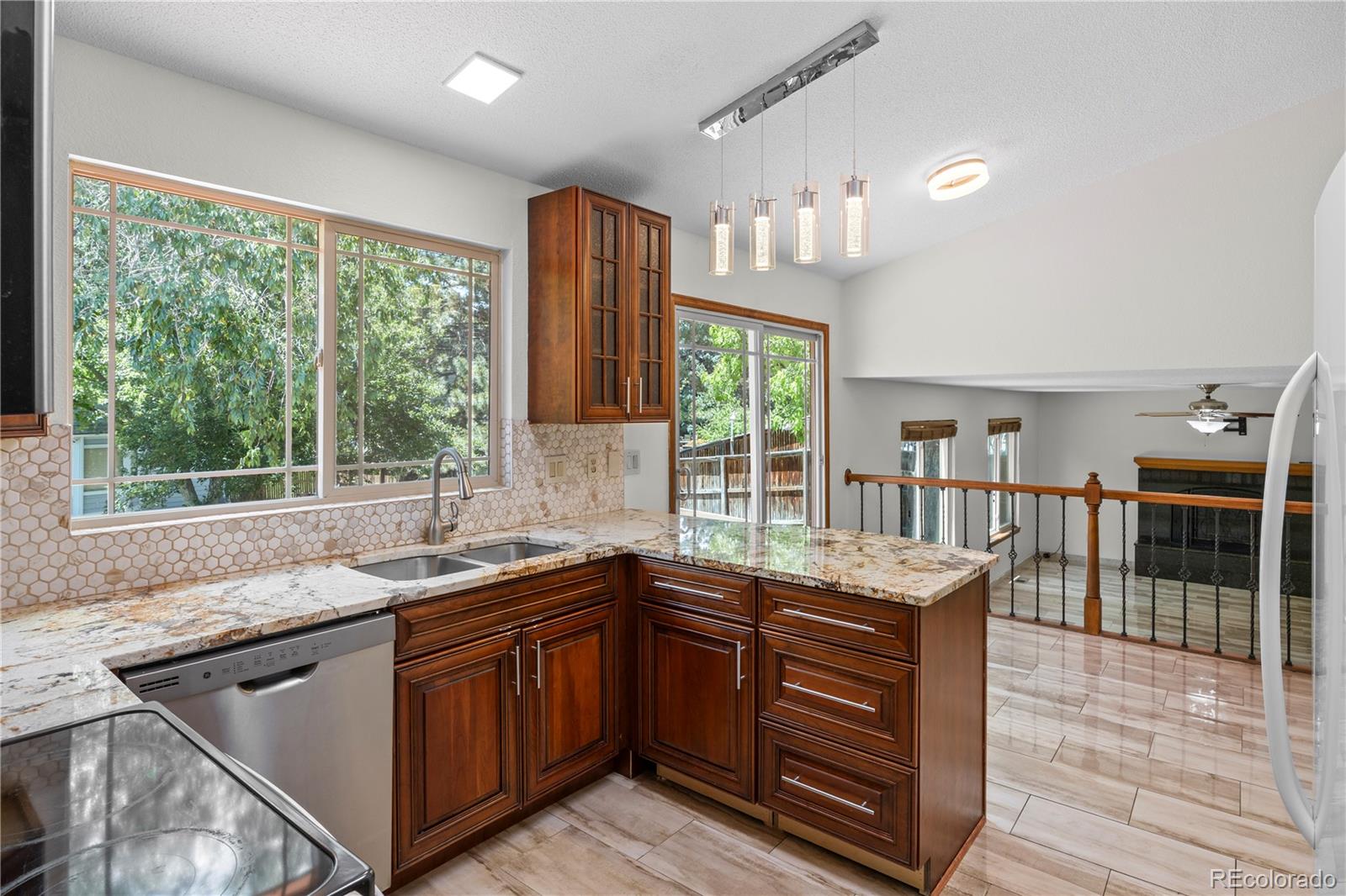 8725 Meadowlark Circle Highlands Ranch, CO 80126 - Photo 12 of 40 a kitchen with a sink and a window