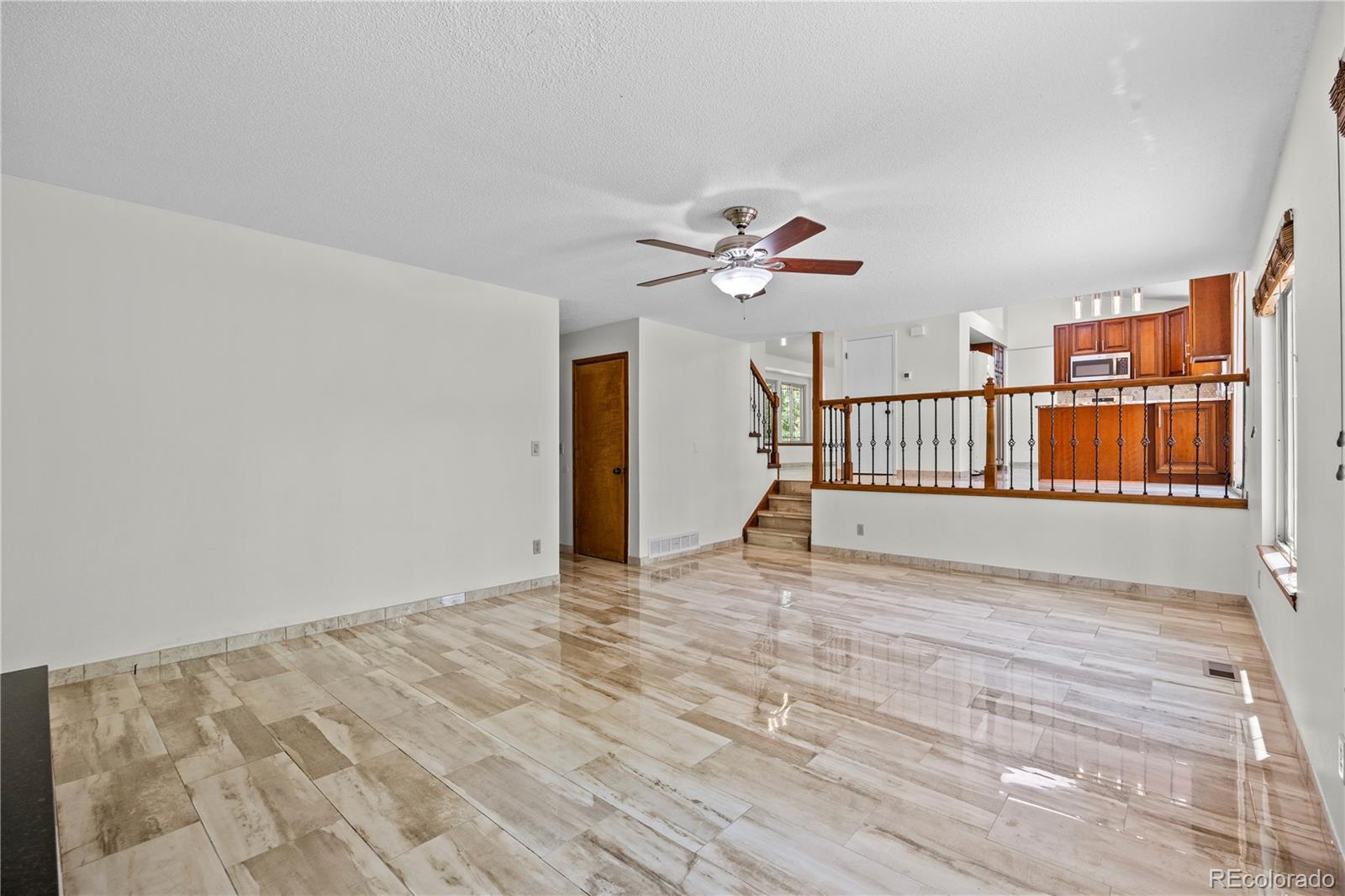 8725 Meadowlark Circle Highlands Ranch, CO 80126 - Photo 13 of 40 a view of a room with wooden floor
