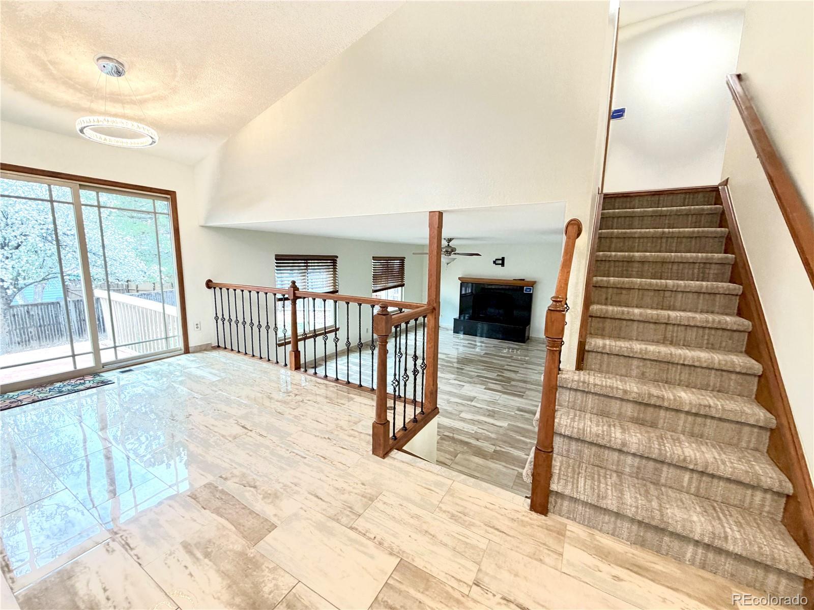 8725 Meadowlark Circle Highlands Ranch, CO 80126 - Photo 14 of 40 a view of staircase with white walls and railing