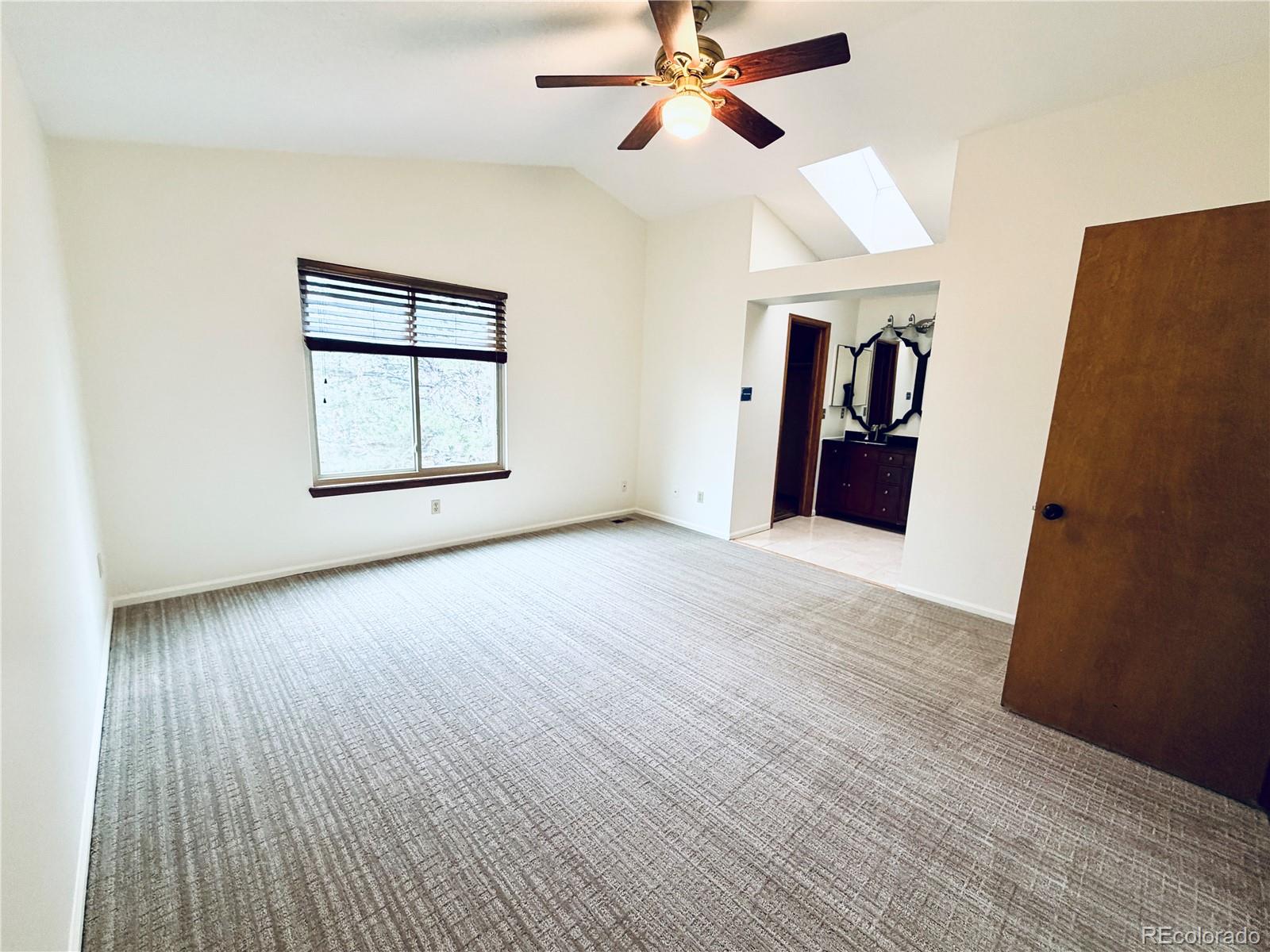 8725 Meadowlark Circle Highlands Ranch, CO 80126 - Photo 16 of 40 wooden floor in an empty room with a window