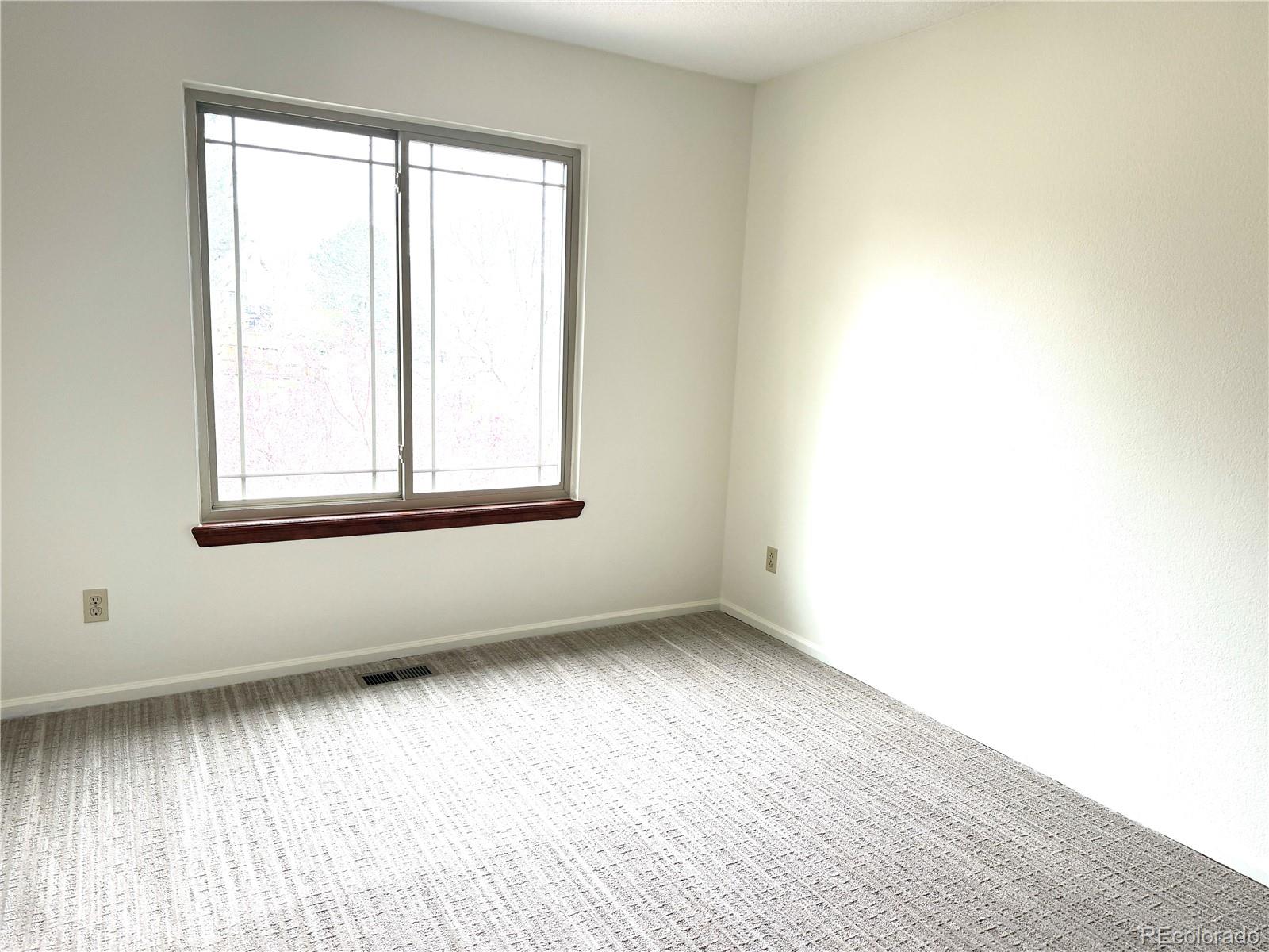 8725 Meadowlark Circle Highlands Ranch, CO 80126 - Photo 20 of 40 an empty room with a window