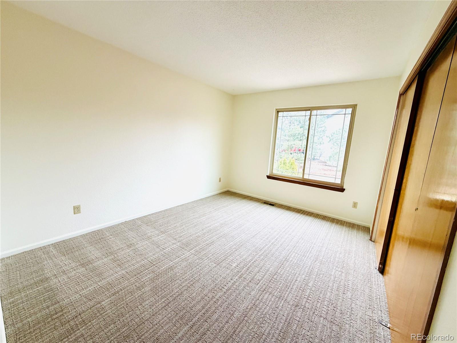 8725 Meadowlark Circle Highlands Ranch, CO 80126 - Photo 22 of 40 an empty room with windows