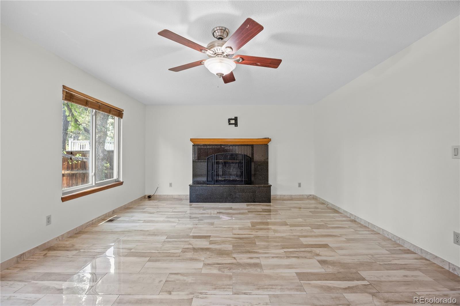 8725 Meadowlark Circle Highlands Ranch, CO 80126 - Photo 4 of 40 a view of an empty room with a window