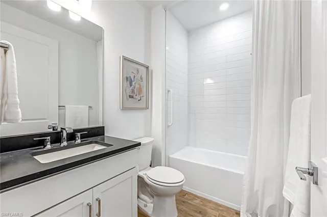 a bathroom with a sink a toilet and a bathtub