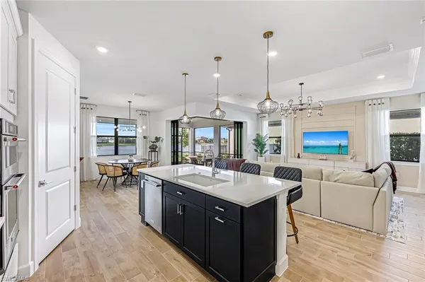 a kitchen with a counter space appliances and furniture