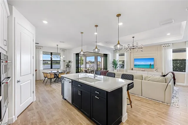 a kitchen with a counter space appliances and furniture