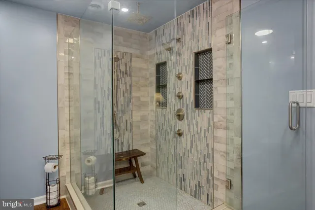 a bathroom with a shower and a sink