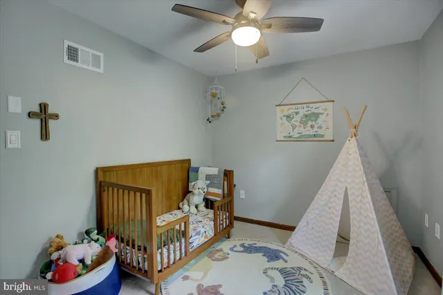 a bedroom with bunk bed and a window