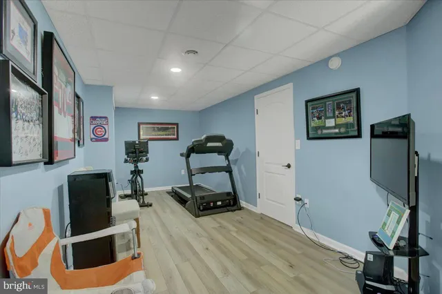 a room with furniture mirror and wooden floor