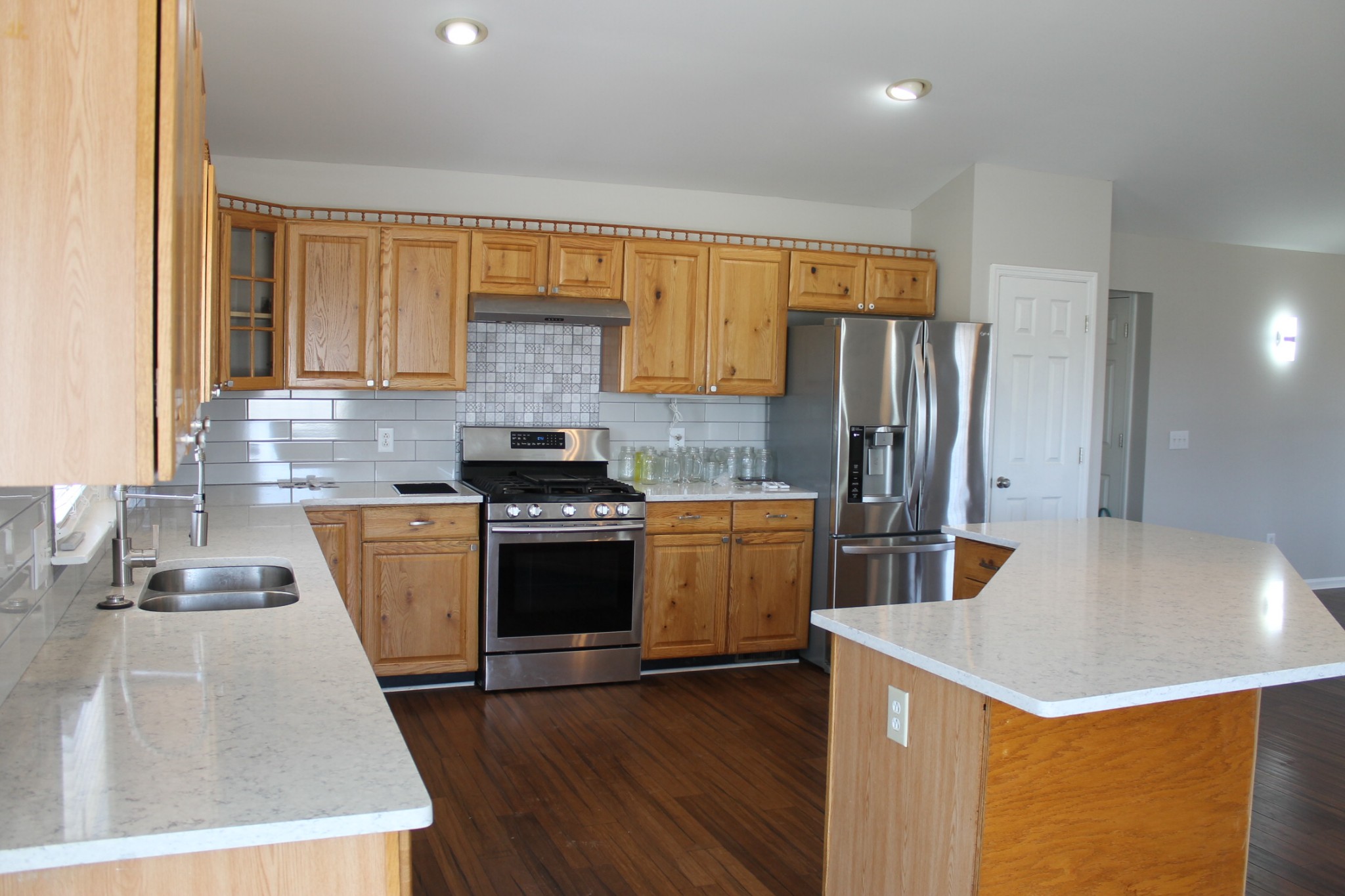 3418 Pinson School Road Springfield, TN 37172 - Photo 13 of 32 a kitchen with stainless steel appliances granite countertop a sink stove and refrigerator