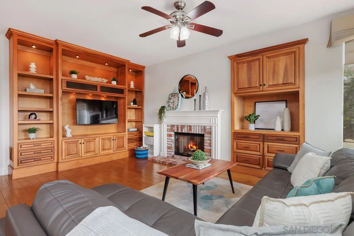 6943 Wildrose Terrace Carlsbad, CA 92011 - Photo 18 of 34 a living room with furniture and a fireplace