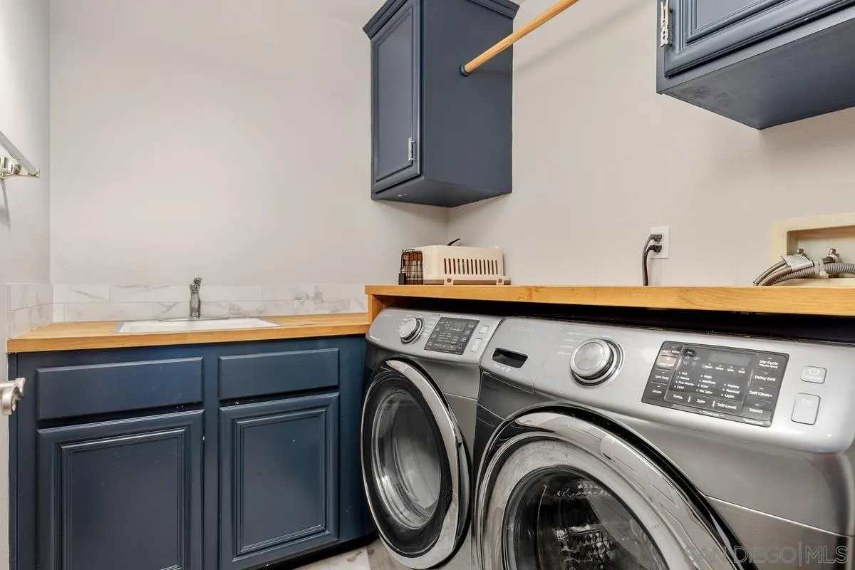 6943 Wildrose Terrace Carlsbad, CA 92011 - Photo 22 of 34 a utility room with dryer and washer