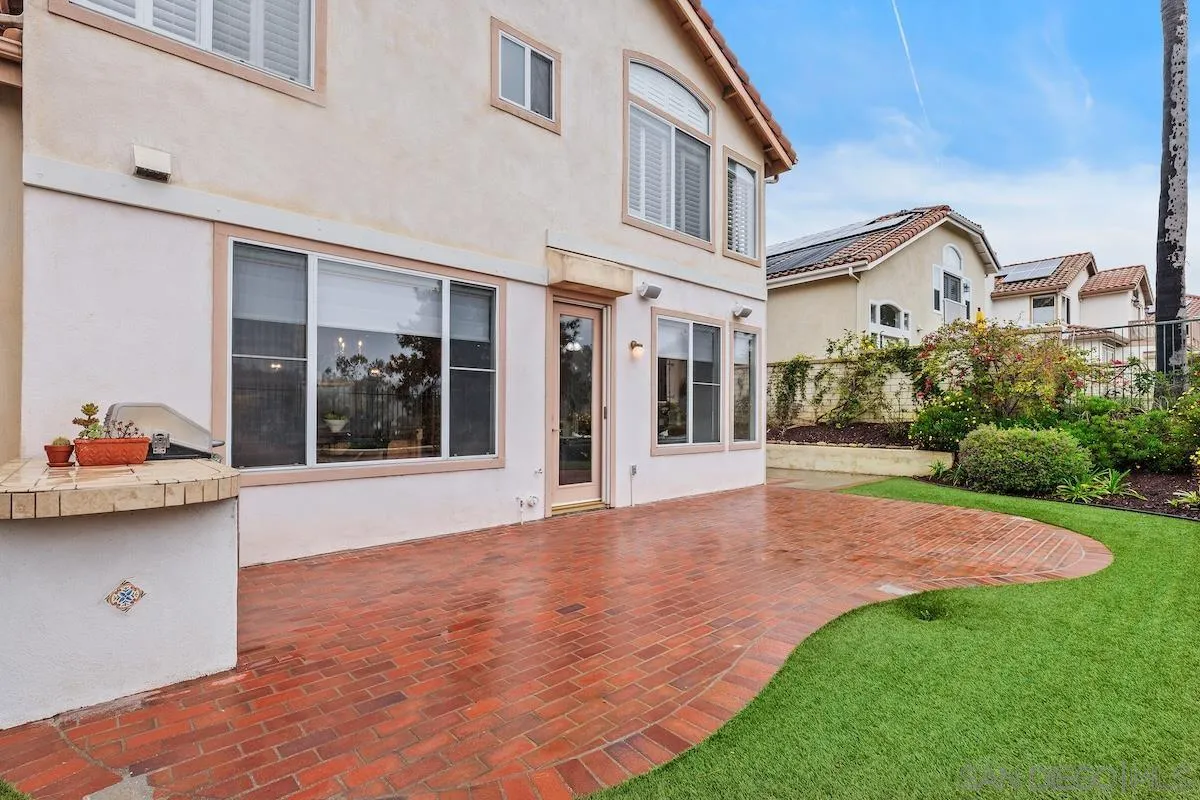 6943 Wildrose Terrace Carlsbad, CA 92011 - Photo 33 of 34 a view of a house with backyard and sitting area