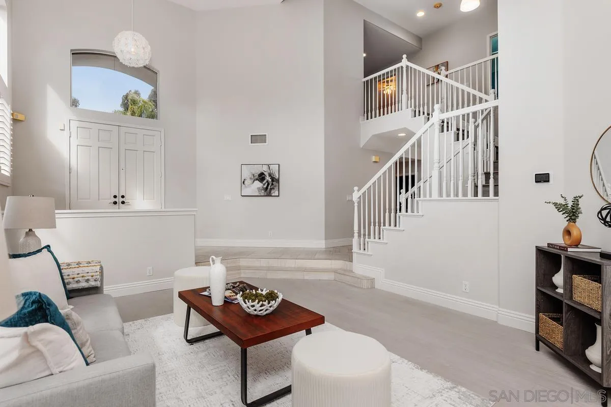 6943 Wildrose Terrace Carlsbad, CA 92011 - Photo 8 of 34 a living room with furniture and a wooden floor
