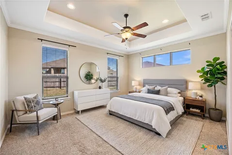 a bedroom with a bed furniture and window