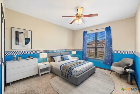 a bedroom with a bed and a couch