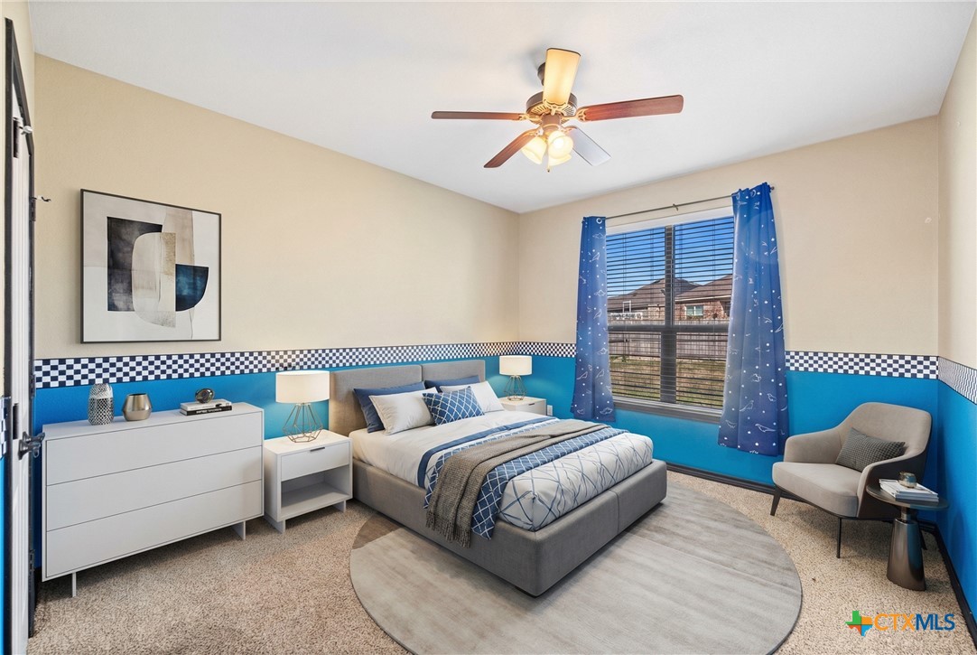 304 Jake Drive Jarrell, TX 76537 - Photo 18 of 30 a bedroom with a bed and a couch