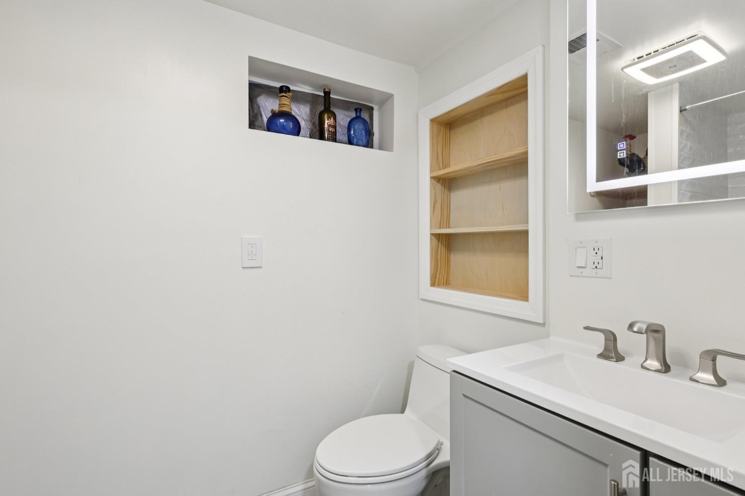 3 Duke Lane Hazlet, NJ 07730 - Photo 28 of 46 a bathroom with a toilet sink and mirror