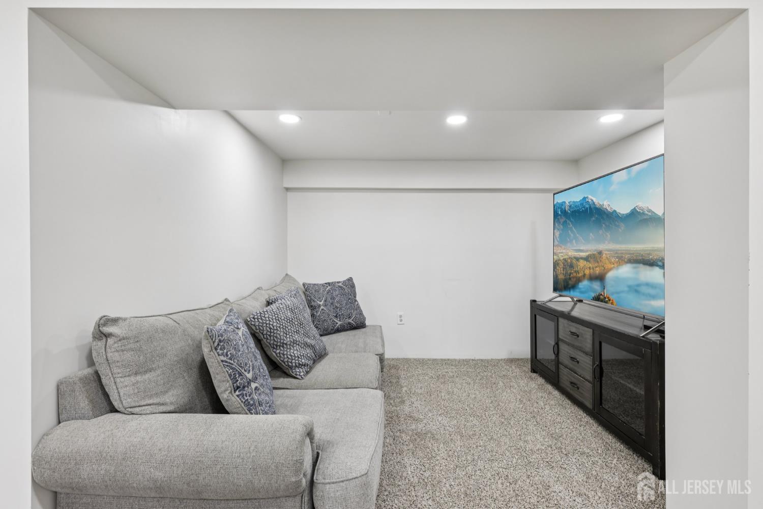 3 Duke Lane Hazlet, NJ 07730 - Photo 31 of 46 a living room with furniture and a flat screen tv