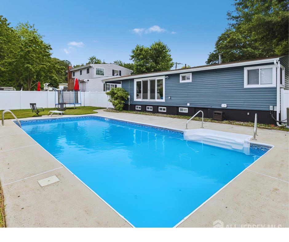 3 Duke Lane Hazlet, NJ 07730 - Photo 38 of 46 a swimming pool with outdoor seating and yard