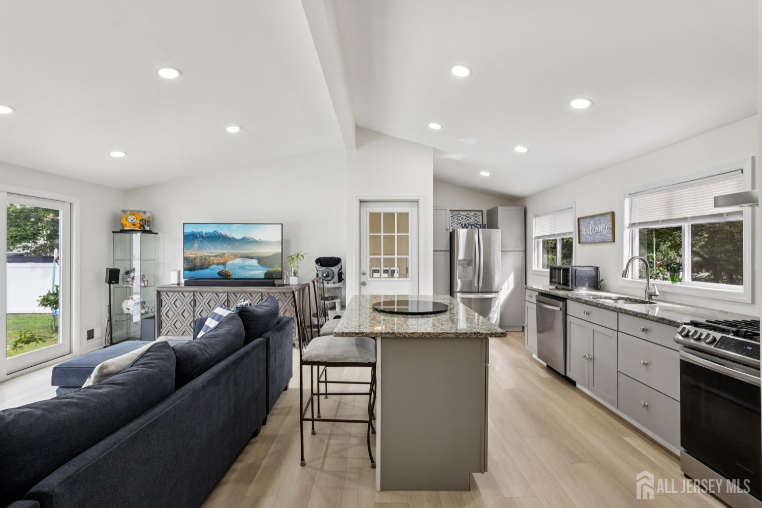 3 Duke Lane Hazlet, NJ 07730 - Photo 6 of 46 a living room with furniture and a kitchen