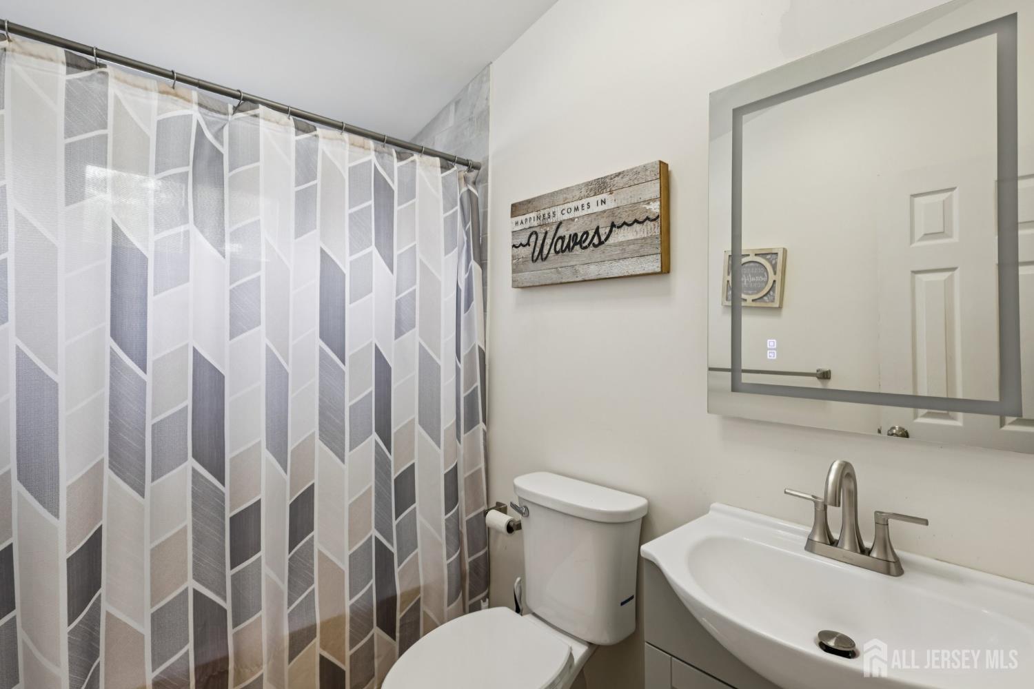 3 Duke Lane Hazlet, NJ 07730 - Photo 9 of 46 a bathroom with a toilet and a sink