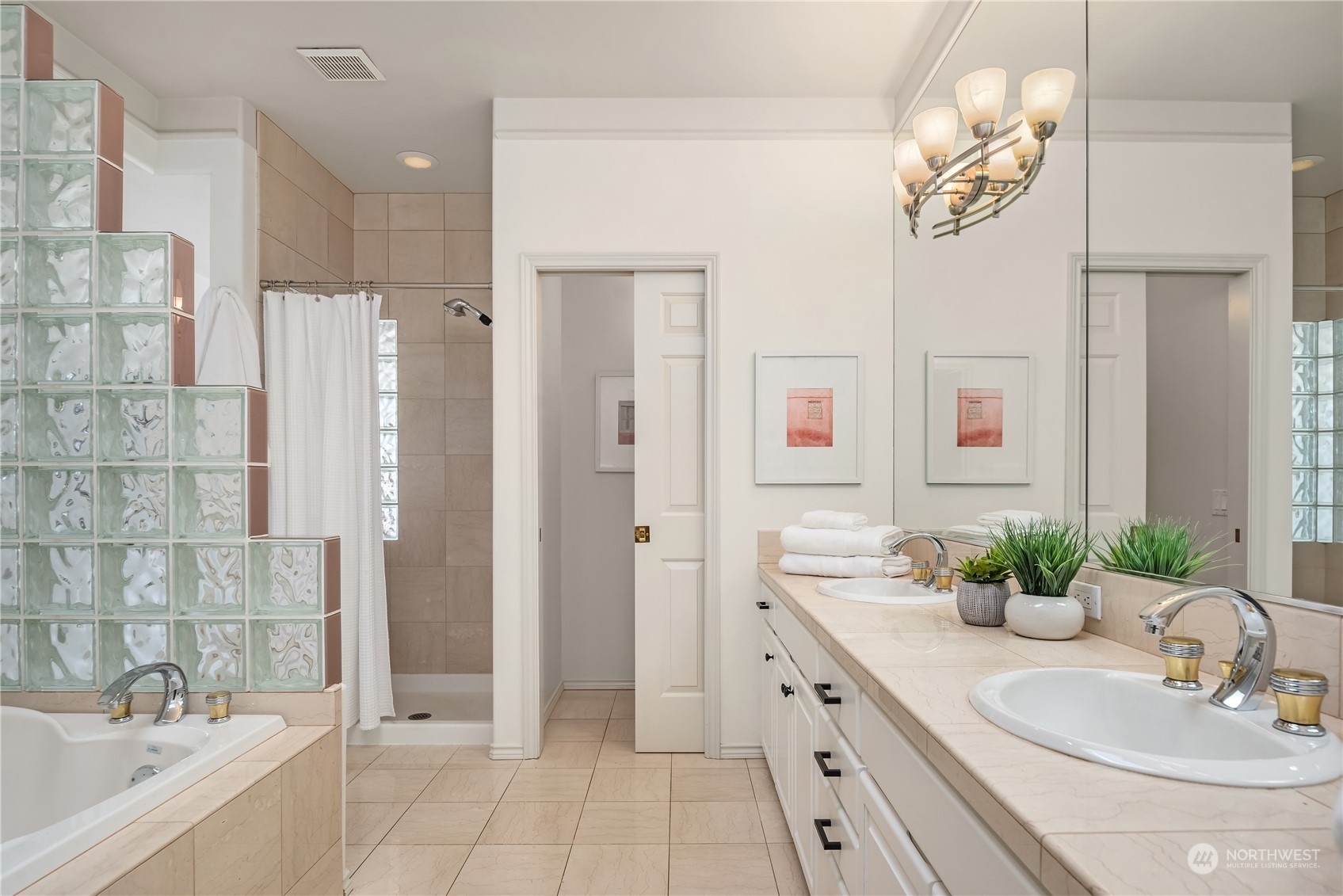 2349 Harbor Avenue Southwest, Unit 705 Seattle, WA 98126 - Photo 26 of 34 a bathroom with a double vanity sink mirror and shower