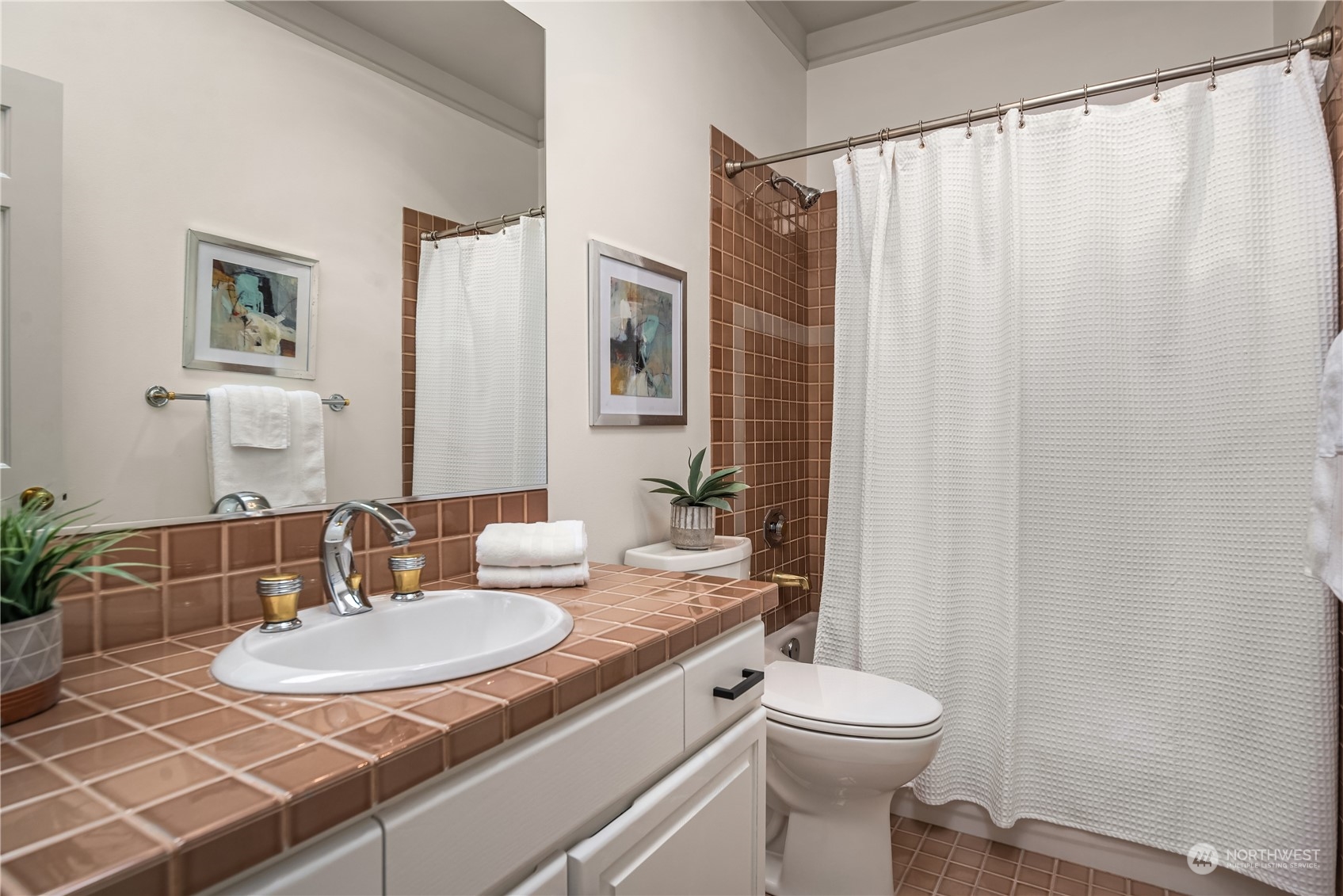 2349 Harbor Avenue Southwest, Unit 705 Seattle, WA 98126 - Photo 30 of 34 a bathroom with a granite countertop sink toilet and shower